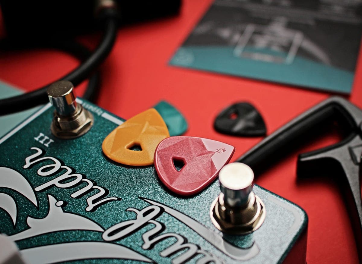 A large fuzz pedal beside a steel-cased distortion pedal