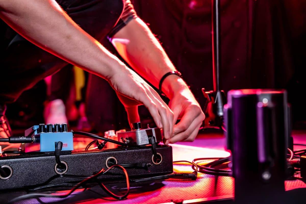 Modulation effect pedals lined up on a wooden surface