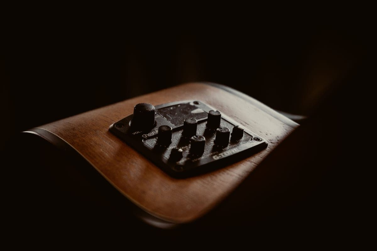 Close detail of the control knobs on a guitar effects pedal
